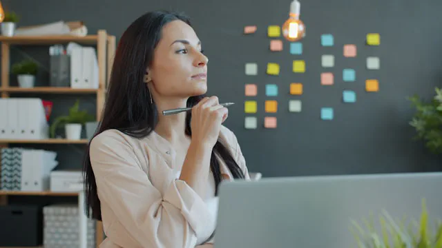Small business starting to build online presence with laptop and planning notes