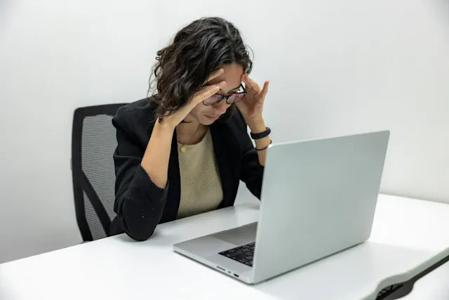 A business owner frustrated while attempting to build a DIY website