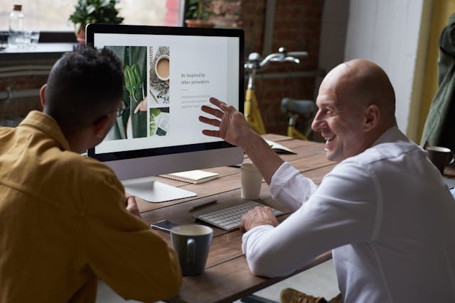 Business owner discussing website project with a web designer