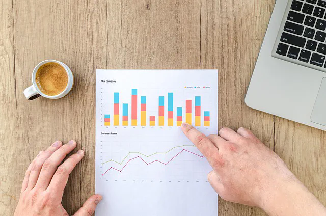 Marketing professional reviewing analytics on a page to improve conversion performance