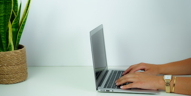 Small business owner reviewing a professionally managed website on a laptop