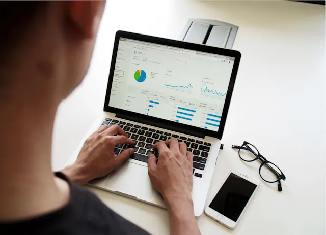 Business owner reviewing digital performance and revenue charts