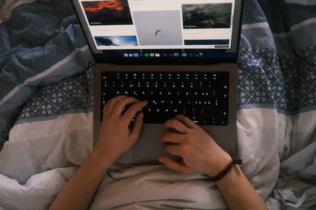 Business owner planning their first website on a laptop with notes
